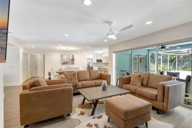 This beautifully maintained 3-bedroom, 2-bath pool home is on Palm Aire Country Club of Sarasota in Florida - for sale on GolfHomes.com, golf home, golf lot