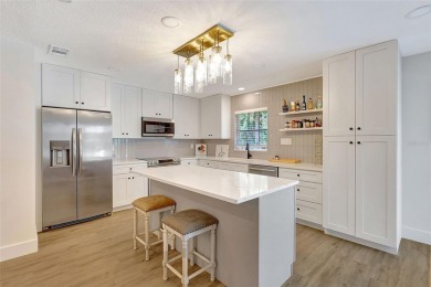 This beautifully maintained 3-bedroom, 2-bath pool home is on Palm Aire Country Club of Sarasota in Florida - for sale on GolfHomes.com, golf home, golf lot