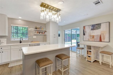 This beautifully maintained 3-bedroom, 2-bath pool home is on Palm Aire Country Club of Sarasota in Florida - for sale on GolfHomes.com, golf home, golf lot
