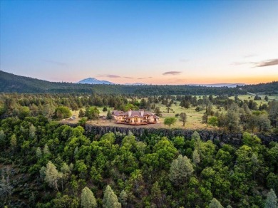 Passing through a custom lava rock gated entry to the impressive on Fall River Valley Golf and Country Club in California - for sale on GolfHomes.com, golf home, golf lot
