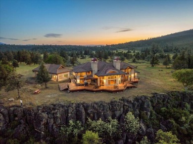 Passing through a custom lava rock gated entry to the impressive on Fall River Valley Golf and Country Club in California - for sale on GolfHomes.com, golf home, golf lot