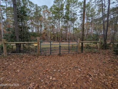 This beautiful, high elevation & fully fenced in lot is located on Minnesott Golf and Country Club in North Carolina - for sale on GolfHomes.com, golf home, golf lot