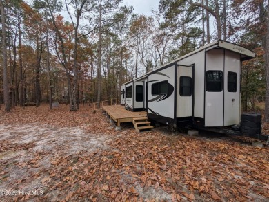 This beautiful, high elevation & fully fenced in lot is located on Minnesott Golf and Country Club in North Carolina - for sale on GolfHomes.com, golf home, golf lot