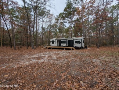 This beautiful, high elevation & fully fenced in lot is located on Minnesott Golf and Country Club in North Carolina - for sale on GolfHomes.com, golf home, golf lot