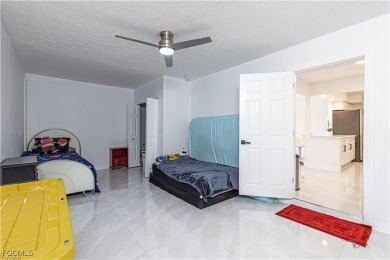 This gorgeous 4 bedroom, 2 bath pool home in the historic Palm on Fort Myers Country Club in Florida - for sale on GolfHomes.com, golf home, golf lot