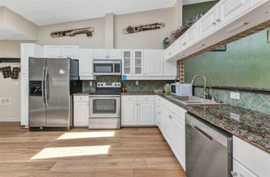 This stunning three-bedroom, two-bath freestanding villa is on Twin Isles Country Club in Florida - for sale on GolfHomes.com, golf home, golf lot