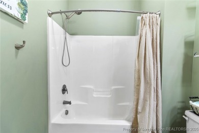 Come tour this spacious 4-bedroom, 2-bathroom single story home on Carolina Trace Country Club in North Carolina - for sale on GolfHomes.com, golf home, golf lot