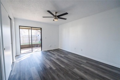 This lovely corner three-bedroom, two-bathroom home is in the on Eastwood Golf Club in Florida - for sale on GolfHomes.com, golf home, golf lot