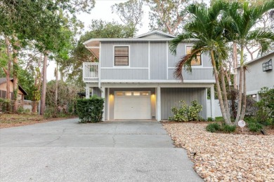 Welcome to this spacious and updated home in Northeast St on Mangrove Bay Golf Course in Florida - for sale on GolfHomes.com, golf home, golf lot