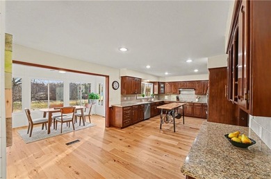 Stunning 1.5-story estate offering 4 bedrooms, 4.1 baths, a 2 on Country Club of Blue Springs in Missouri - for sale on GolfHomes.com, golf home, golf lot