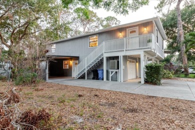 Welcome to this spacious and updated home in Northeast St on Mangrove Bay Golf Course in Florida - for sale on GolfHomes.com, golf home, golf lot