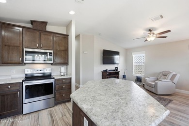 Experience resort-style living in this beautifully maintained on Augusta Ranch Golf Club in Arizona - for sale on GolfHomes.com, golf home, golf lot