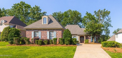 This spacious 4 bedroom, 3 bathroom home is situated in the on Lake Caroline Golf Club in Mississippi - for sale on GolfHomes.com, golf home, golf lot