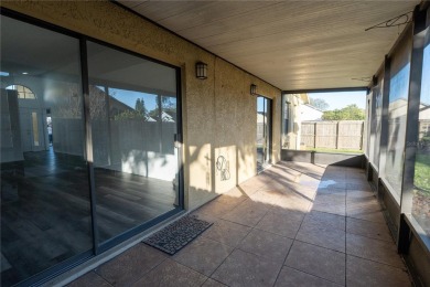 This lovely corner three-bedroom, two-bathroom home is in the on Eastwood Golf Club in Florida - for sale on GolfHomes.com, golf home, golf lot