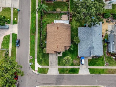 This lovely corner three-bedroom, two-bathroom home is in the on Eastwood Golf Club in Florida - for sale on GolfHomes.com, golf home, golf lot