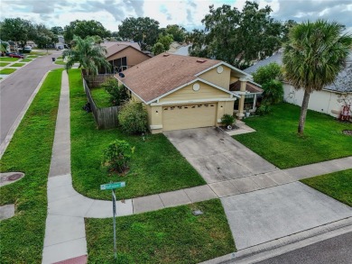 This lovely corner three-bedroom, two-bathroom home is in the on Eastwood Golf Club in Florida - for sale on GolfHomes.com, golf home, golf lot