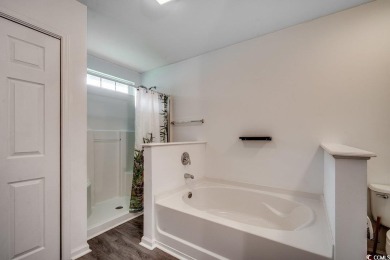 This beautifully maintained three-bedroom home offers a seamless on Heron Point Golf Club in South Carolina - for sale on GolfHomes.com, golf home, golf lot