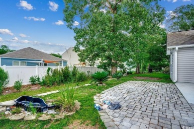 This beautifully maintained three-bedroom home offers a seamless on Heron Point Golf Club in South Carolina - for sale on GolfHomes.com, golf home, golf lot