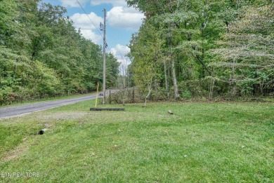 This beautiful brick BASEMENT RANCH home, nestled on 2 lots in on Lake Tansi Village Country Club in Tennessee - for sale on GolfHomes.com, golf home, golf lot