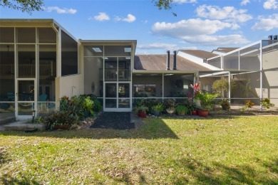 This townhouse is located on Meadow #1 of the Carrollwood on Carrollwood Country Club in Florida - for sale on GolfHomes.com, golf home, golf lot