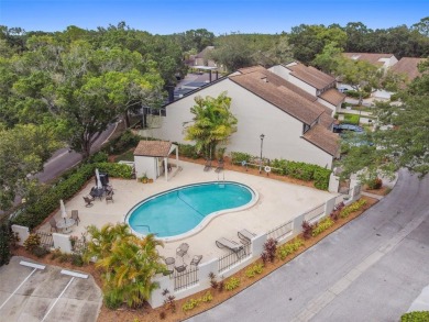 This townhouse is located on Meadow #1 of the Carrollwood on Carrollwood Country Club in Florida - for sale on GolfHomes.com, golf home, golf lot