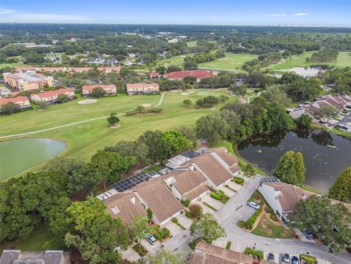 This townhouse is located on Meadow #1 of the Carrollwood on Carrollwood Country Club in Florida - for sale on GolfHomes.com, golf home, golf lot