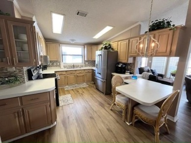 Updated 2/bd2/ba home offers an ideal blend of elegance & on Del Tura Golf and Country Club in Florida - for sale on GolfHomes.com, golf home, golf lot