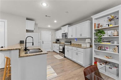 Welcome to this update 1,480 square foot home in the wooded on Bella Vista - Metfield Golf Complex and Country Club in Arkansas - for sale on GolfHomes.com, golf home, golf lot