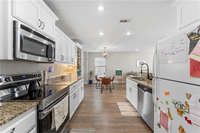 Welcome to this update 1,480 square foot home in the wooded on Bella Vista - Metfield Golf Complex and Country Club in Arkansas - for sale on GolfHomes.com, golf home, golf lot