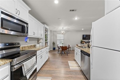 Welcome to this update 1,480 square foot home in the wooded on Bella Vista - Metfield Golf Complex and Country Club in Arkansas - for sale on GolfHomes.com, golf home, golf lot