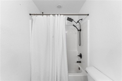 Welcome to this update 1,480 square foot home in the wooded on Bella Vista - Metfield Golf Complex and Country Club in Arkansas - for sale on GolfHomes.com, golf home, golf lot