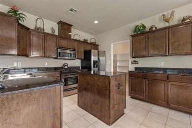 Discover this beautifully cared for 4-bedroom, 2 1/2  bath home on Broken Arrow Golf and Athletic Club in Oklahoma - for sale on GolfHomes.com, golf home, golf lot