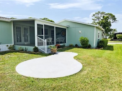 This updated 2bd/2ba furnished home with a golf and water view on Del Tura Golf and Country Club in Florida - for sale on GolfHomes.com, golf home, golf lot