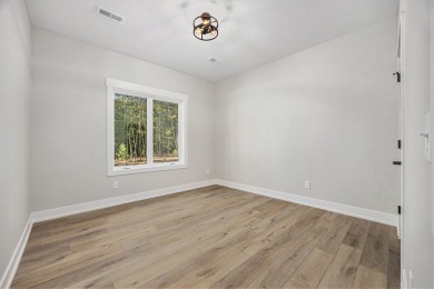 Discover your dream home with effortless living and modern on Oak Ridge Golf Club in Michigan - for sale on GolfHomes.com, golf home, golf lot