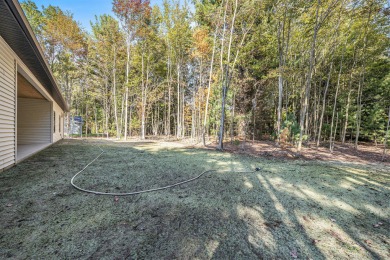 Discover your dream home with effortless living and modern on Oak Ridge Golf Club in Michigan - for sale on GolfHomes.com, golf home, golf lot