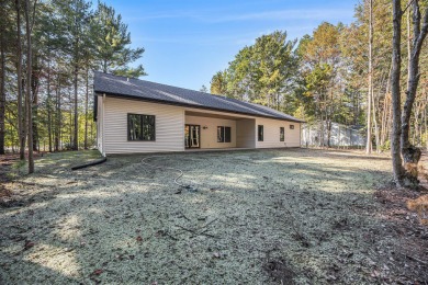 Discover your dream home with effortless living and modern on Oak Ridge Golf Club in Michigan - for sale on GolfHomes.com, golf home, golf lot