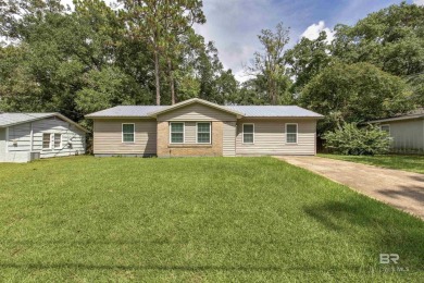 This updated 4-bedroom, 2-bath home is an excellent opportunity on Azalea City Golf Course in Alabama - for sale on GolfHomes.com, golf home, golf lot