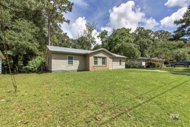 This updated 4-bedroom, 2-bath home is an excellent opportunity on Azalea City Golf Course in Alabama - for sale on GolfHomes.com, golf home, golf lot
