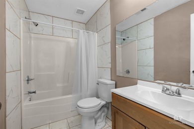 This updated 4-bedroom, 2-bath home is an excellent opportunity on Azalea City Golf Course in Alabama - for sale on GolfHomes.com, golf home, golf lot