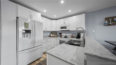 Discover the perfect blend of lakefront luxury and location at on Sycamore Creek Golf Club in Missouri - for sale on GolfHomes.com, golf home, golf lot