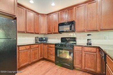 Experience Luxury & Maintenance Free Living in this END UNIT on Country Club of the Poconos Golf Course in Pennsylvania - for sale on GolfHomes.com, golf home, golf lot