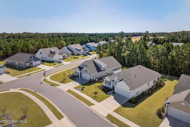 Welcome to 7952 Harrier Circle in the sought-after Heron Pointe on Cape Fear National At Brunswick Forest in North Carolina - for sale on GolfHomes.com, golf home, golf lot