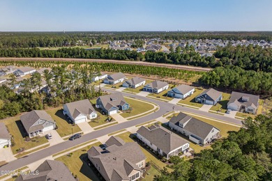 Welcome to 7952 Harrier Circle in the sought-after Heron Pointe on Cape Fear National At Brunswick Forest in North Carolina - for sale on GolfHomes.com, golf home, golf lot