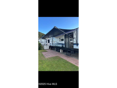 Adorable and very clean 2022 Keystone Springdale located on a on North Shore Country Club in North Carolina - for sale on GolfHomes.com, golf home, golf lot