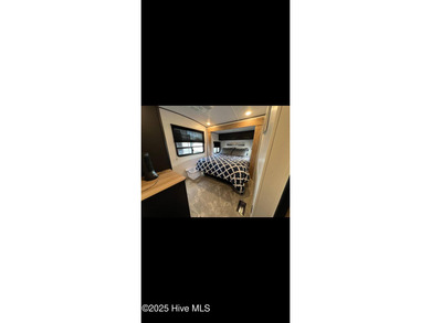 Adorable and very clean 2022 Keystone Springdale located on a on North Shore Country Club in North Carolina - for sale on GolfHomes.com, golf home, golf lot