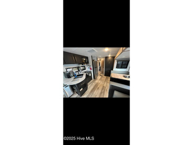 Adorable and very clean 2022 Keystone Springdale located on a on North Shore Country Club in North Carolina - for sale on GolfHomes.com, golf home, golf lot