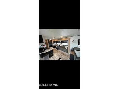 Adorable and very clean 2022 Keystone Springdale located on a on North Shore Country Club in North Carolina - for sale on GolfHomes.com, golf home, golf lot