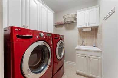 Modern luxury meets classic Southern charm in this iconic Laurel on Laurel Springs Golf Club in Georgia - for sale on GolfHomes.com, golf home, golf lot