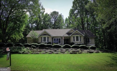 An absolutely beautiful home situated on a natural wooded on Canongate On White Oak Golf Course in Georgia - for sale on GolfHomes.com, golf home, golf lot