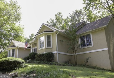 An absolutely beautiful home situated on a natural wooded on Canongate On White Oak Golf Course in Georgia - for sale on GolfHomes.com, golf home, golf lot